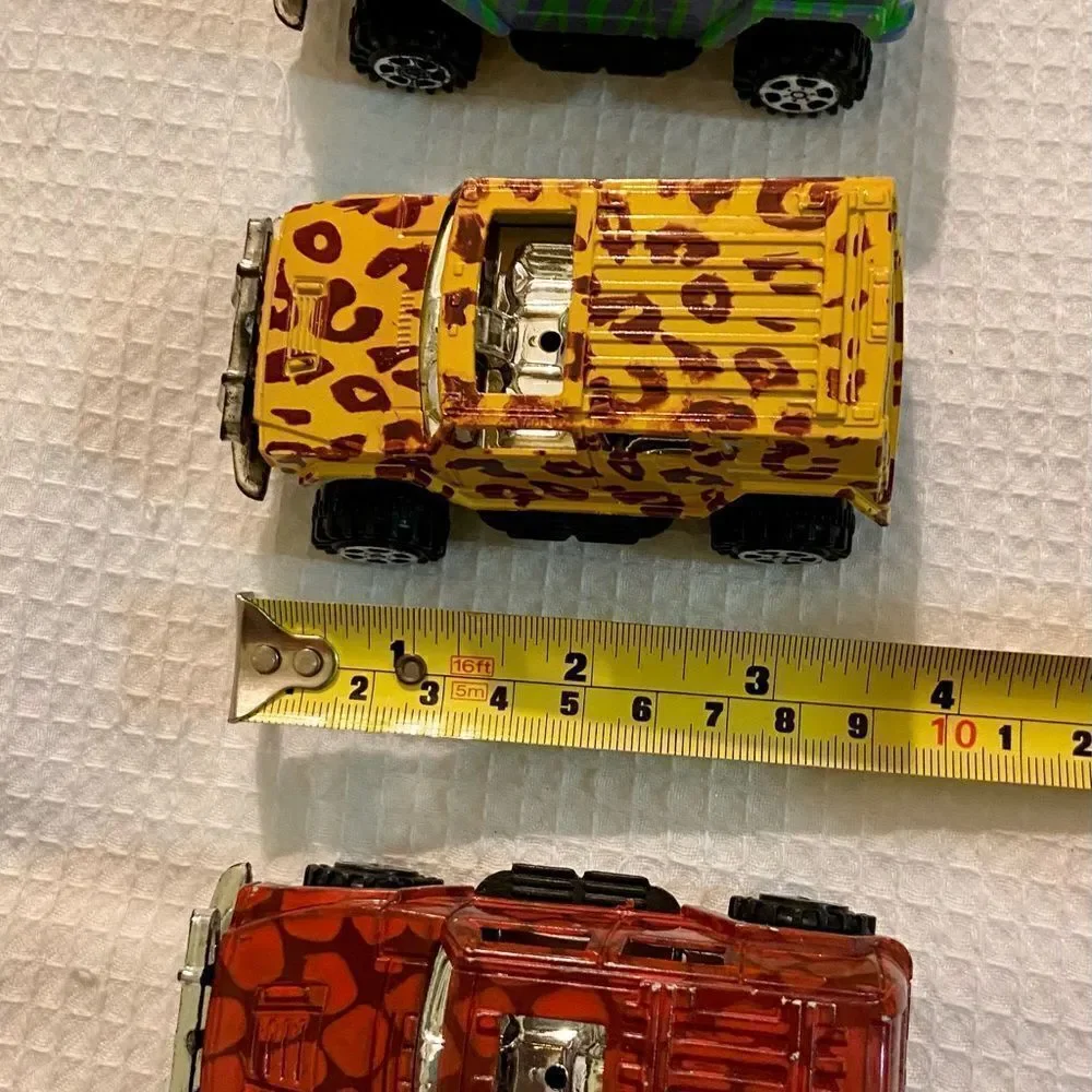Vintage Lot Of 3 Toy 4 X 4 Trucks W Animal Prints Good Condition Unbranded.